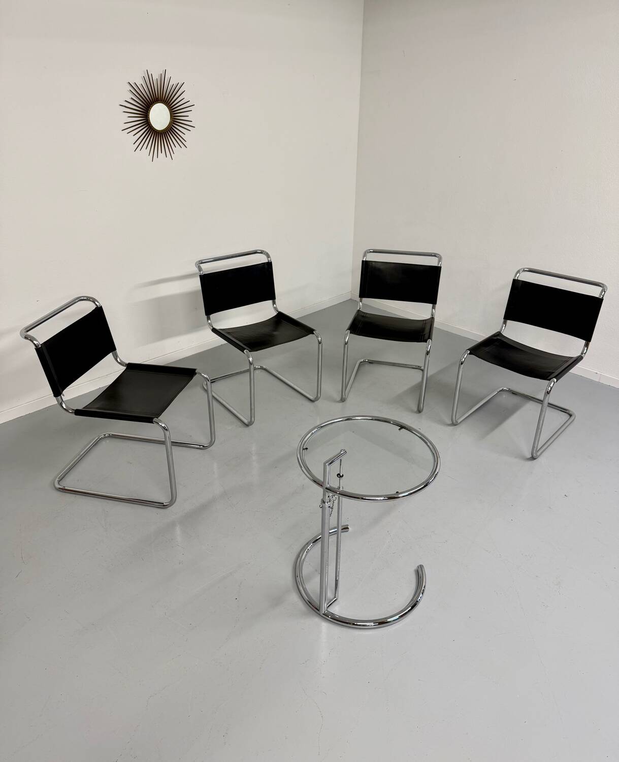 Lot of 4 tubular chairs designed by Mart Stam in vintage black leather from the 1980s.