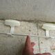 White metal wall coat rack with 2 hooks from the 70s