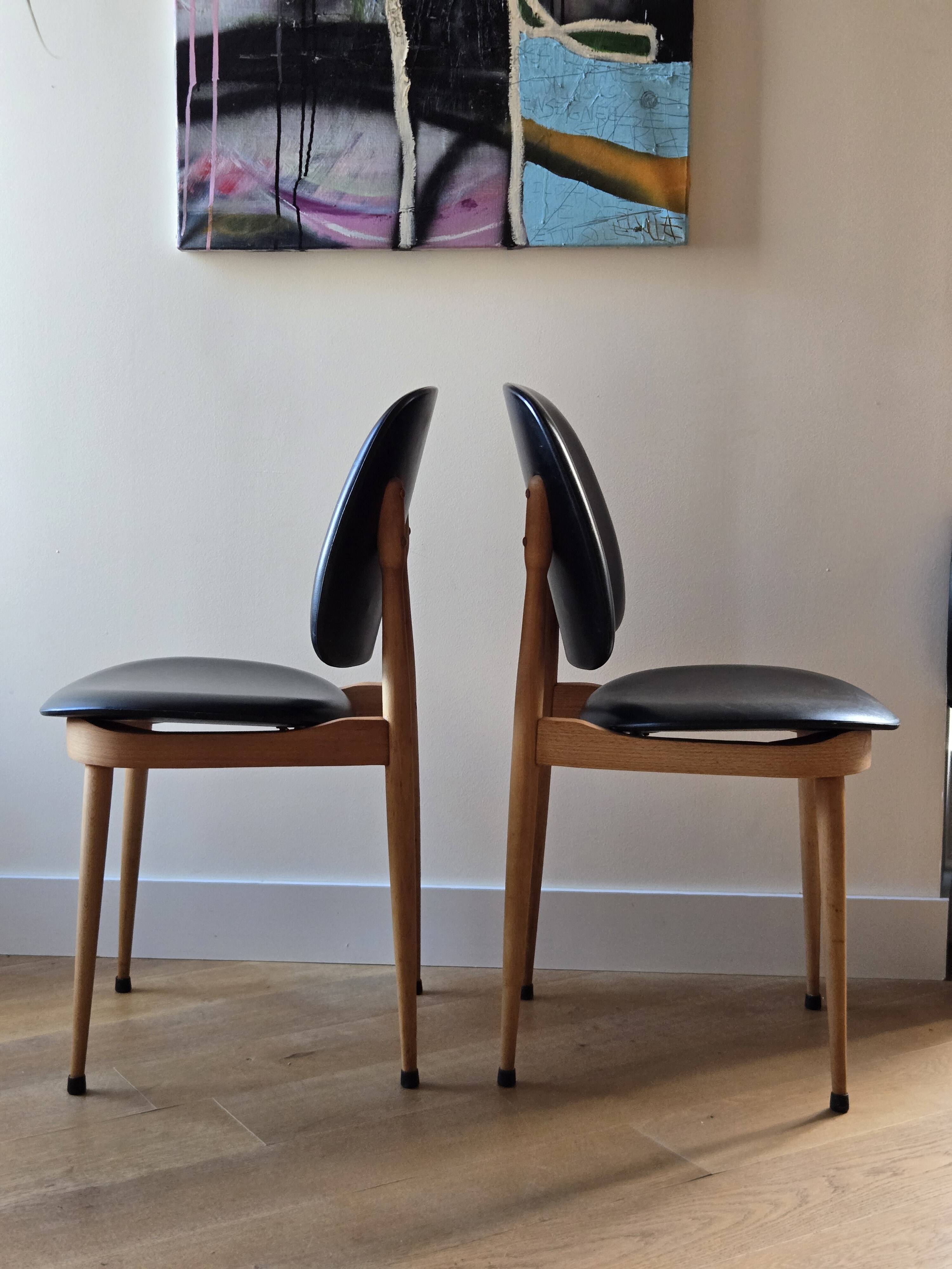 Pair of Baumann Pegasus chairs in wood and leather - design by Pierre Guariche
