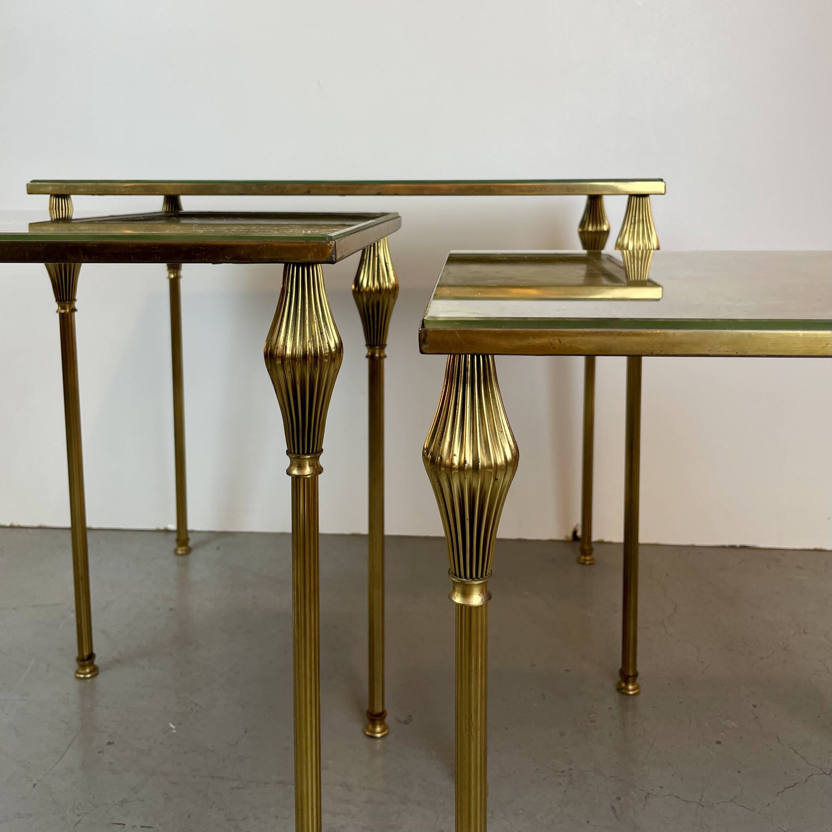 Nested brass tables, attributed to Maison Baguès, France, 1950–60.