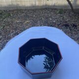Black Arcoroc octagonal bowl with red edging.