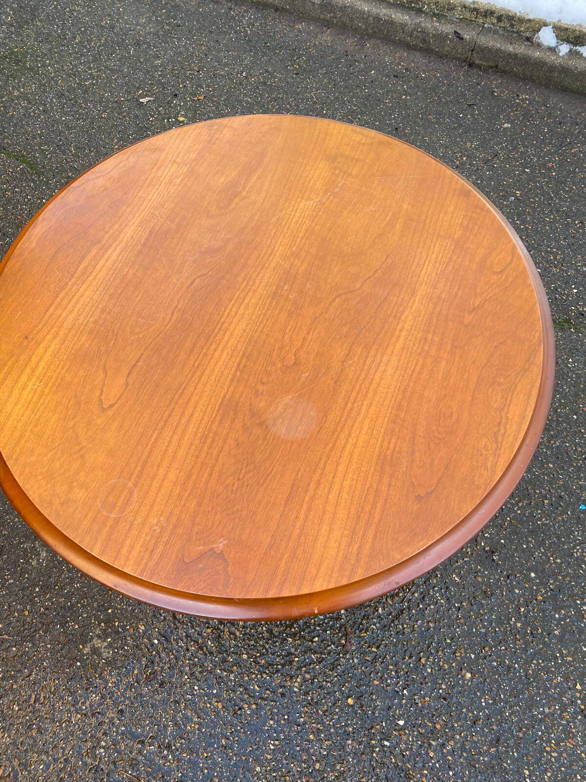 Round side table with a central solid wood leg from the 20th century.