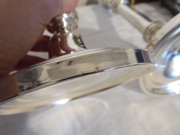 Pair of silver metal candle holders