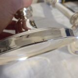 Pair of silver metal candle holders