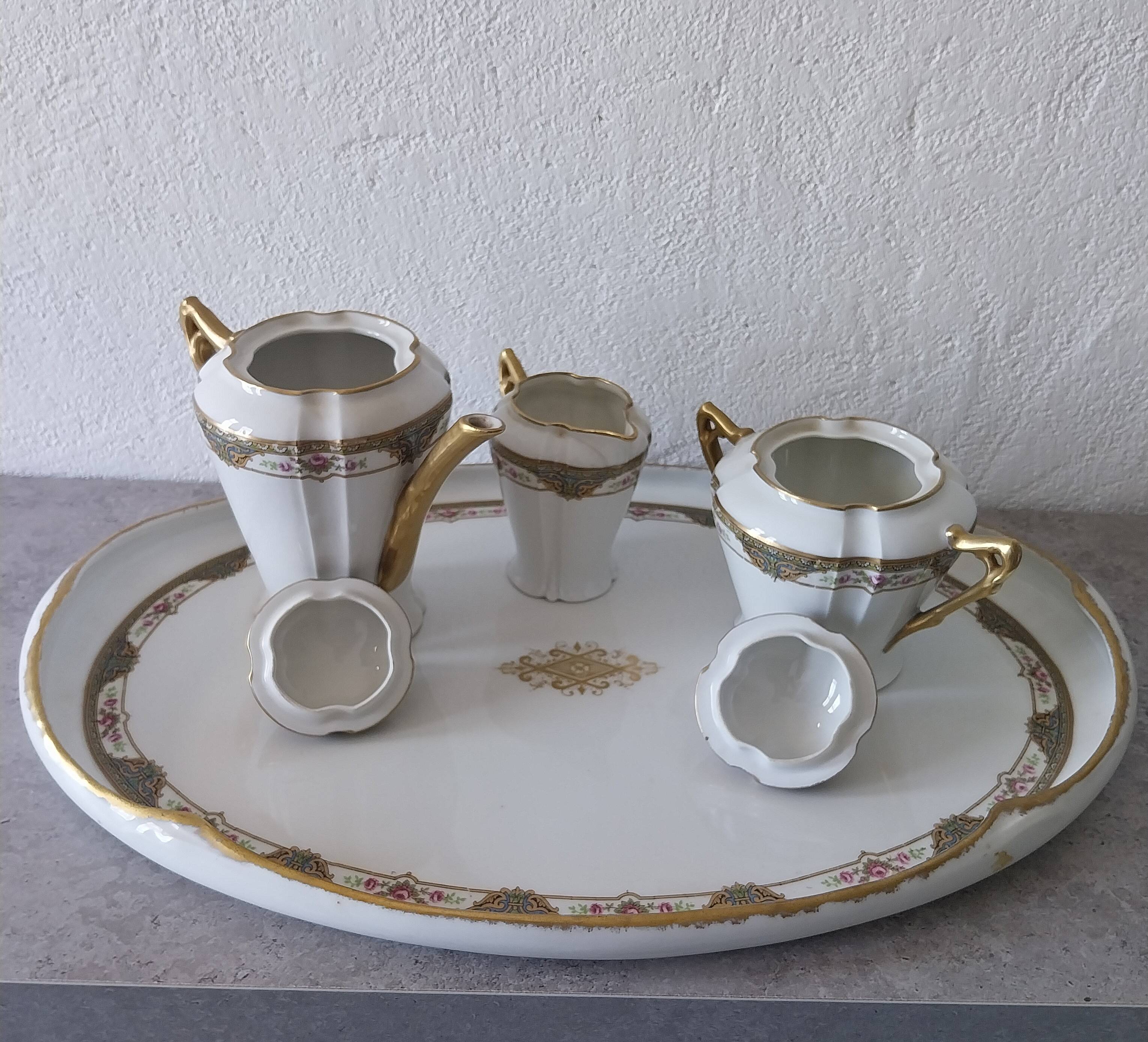 Coffee and tea service for two with its tray in Limoges porcelain.