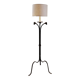 Wrought iron tripod floor lamp decorated with stylized animal heads