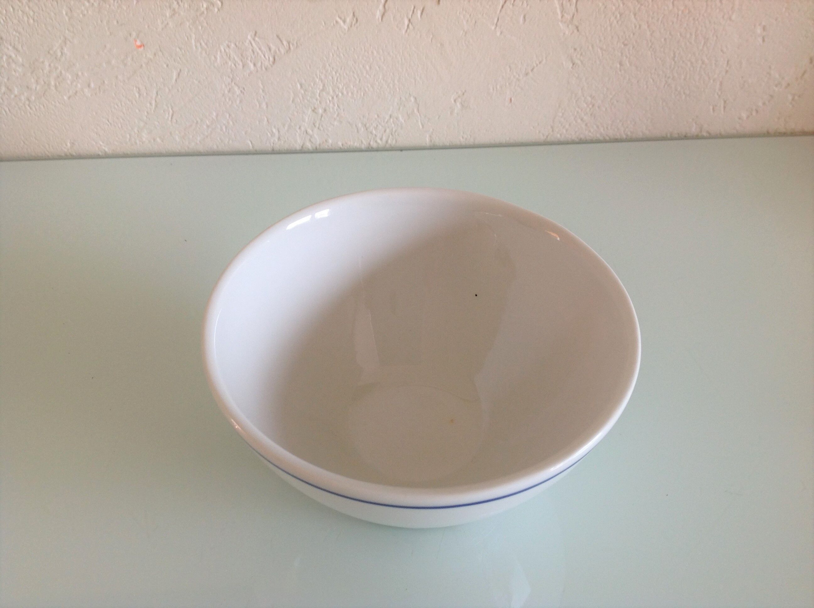 White bowl with blue border of the faienceries of Sarreguemines