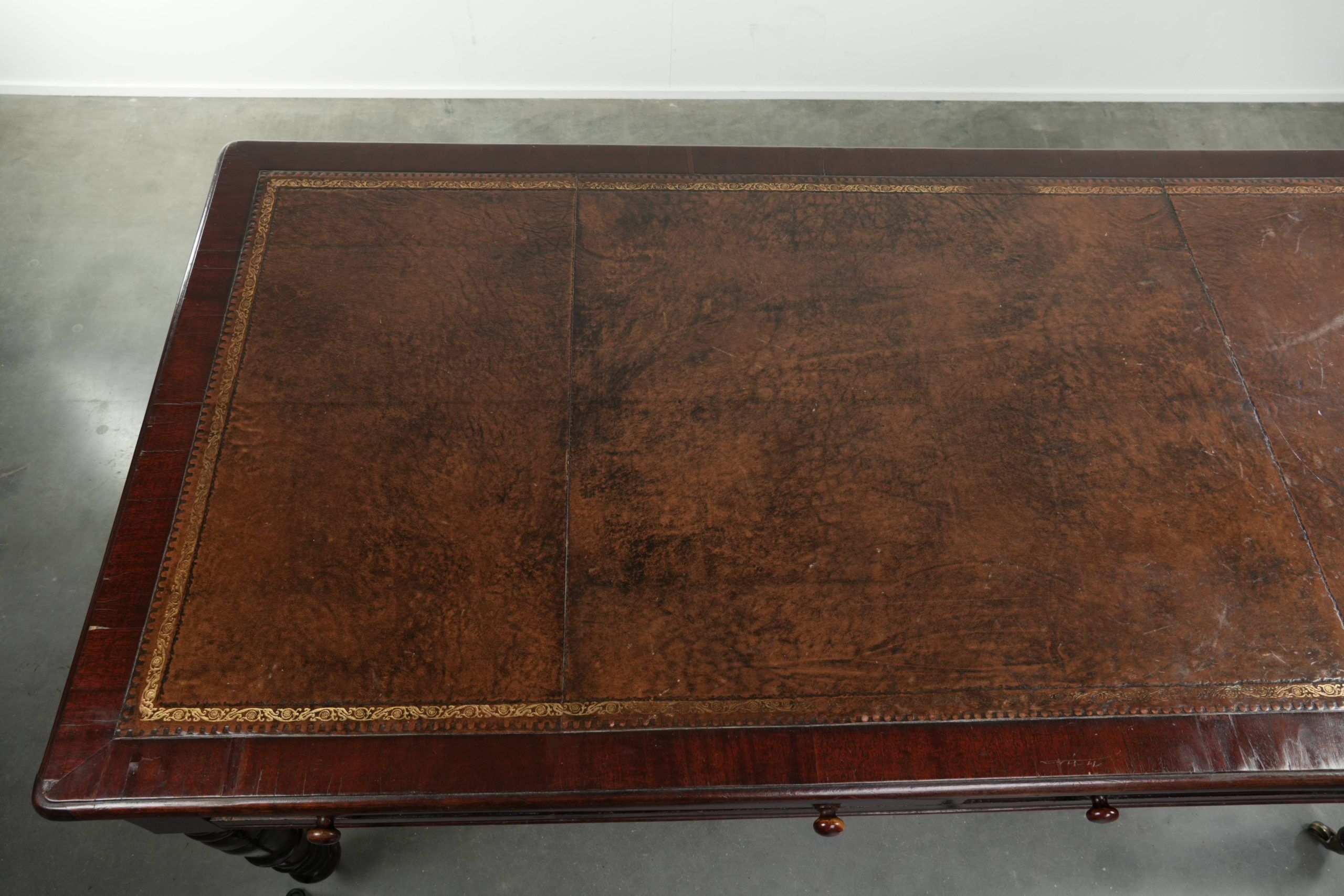 Antique English writing desk from the late 19th century with a warm colour