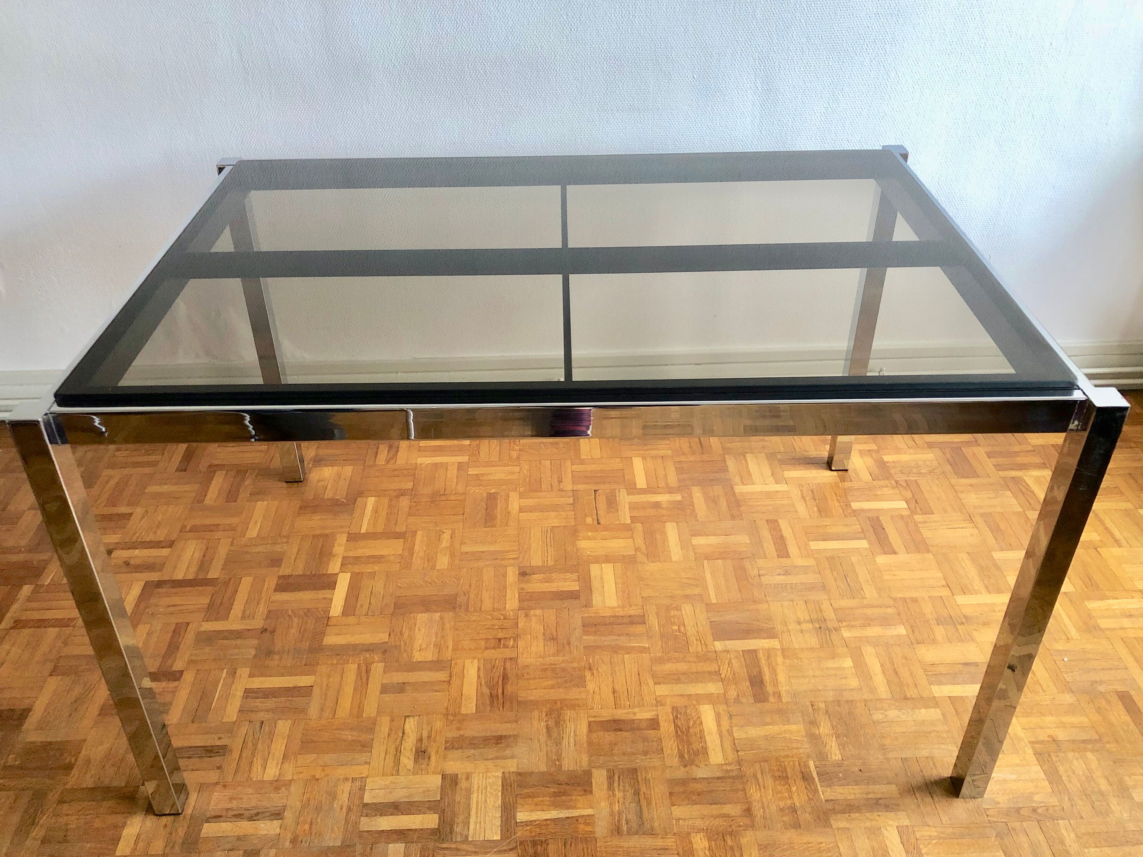 Glass and chrome metal dining table
