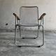 Set of two vintage folding chairs with an aluminium wire frame.