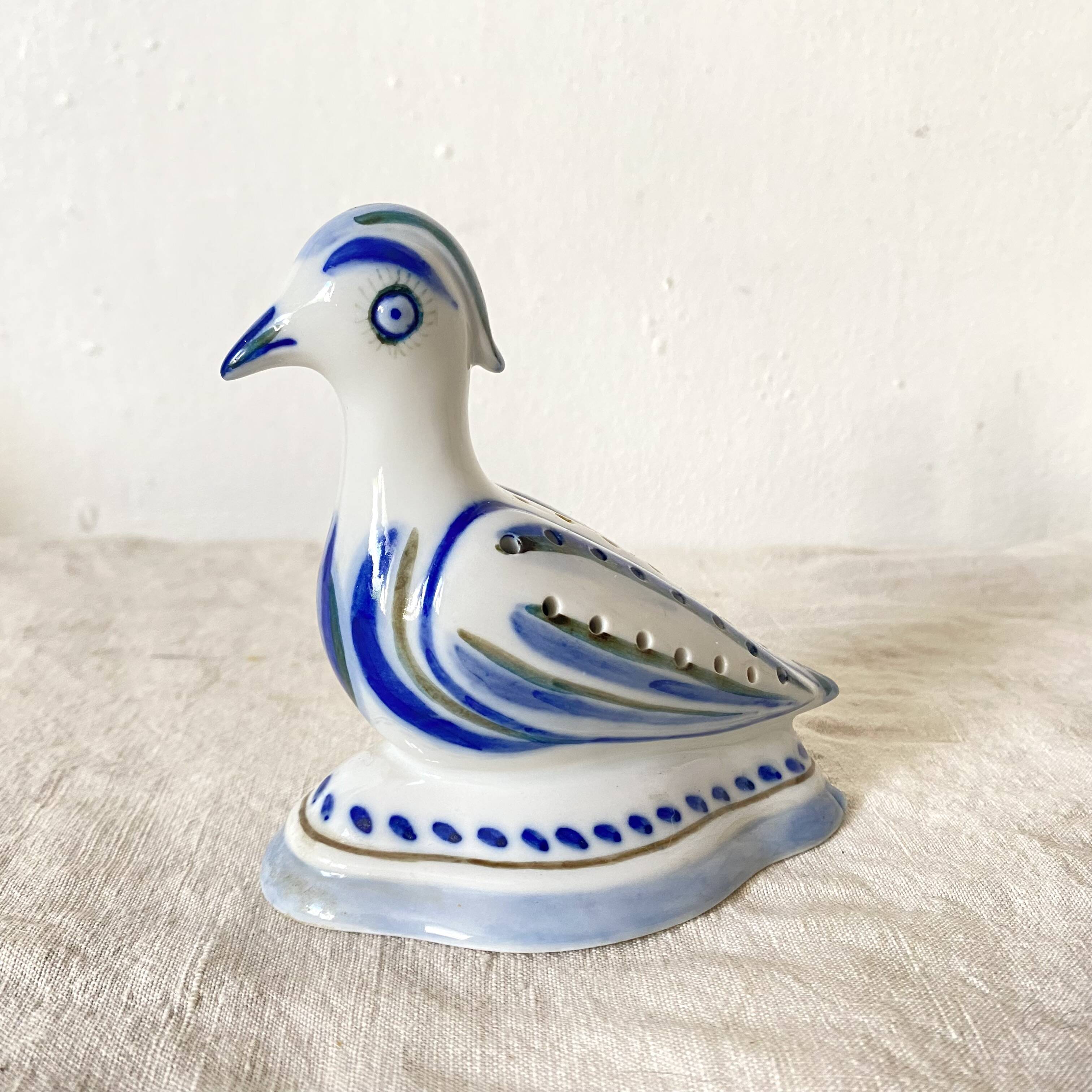 Porcelain bird, flower vase