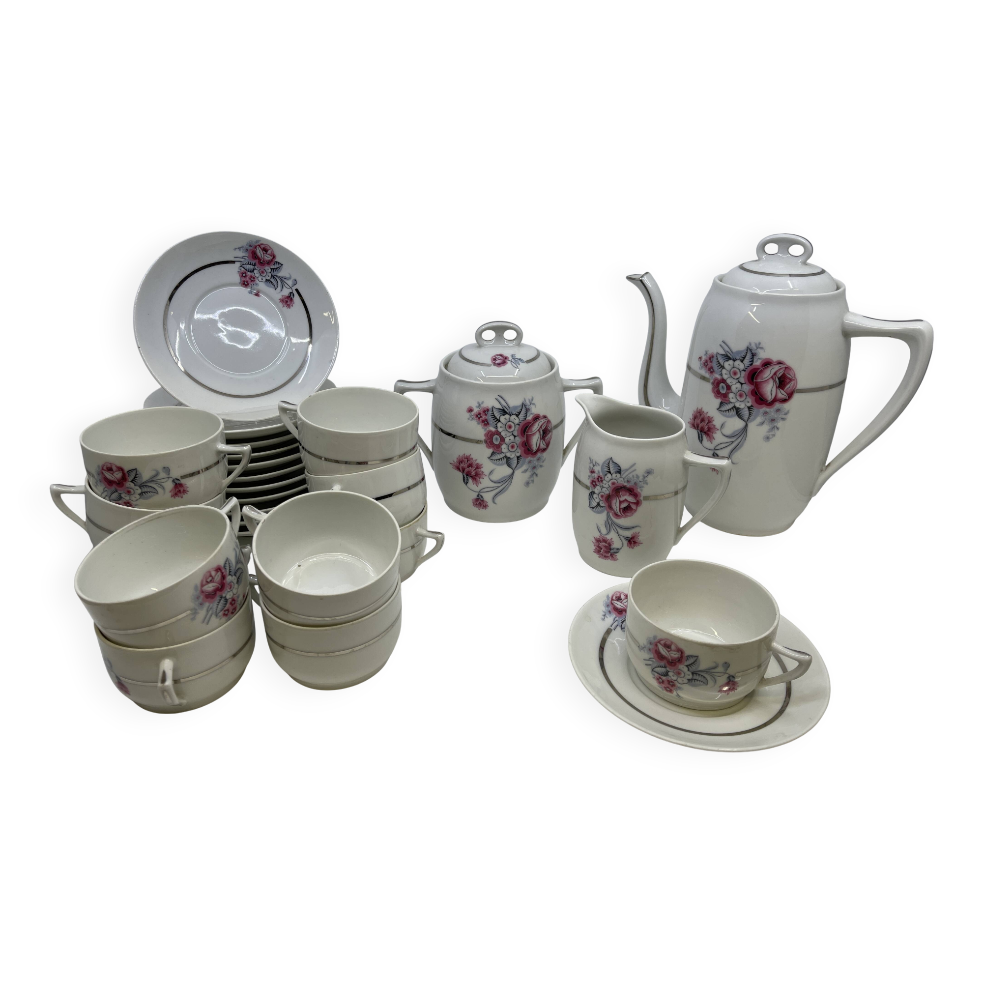 Porcelain coffee service with floral decoration and silver trim.