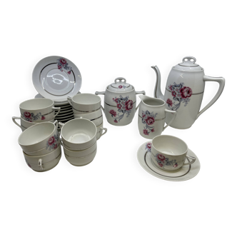 Porcelain coffee service with floral decoration and silver trim.