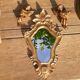 Miroir baroque bois doré et 2 angelots