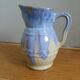 Pastel blue pitcher signed
