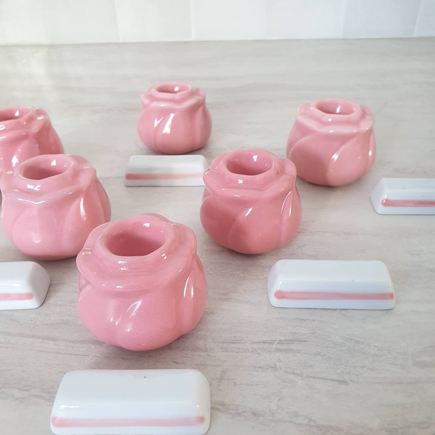 Pink candlesticks and porcelain knife holders