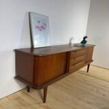 Vintage teak sideboard with rounded edges and sliding doors – mid-century Scandinavian design.
