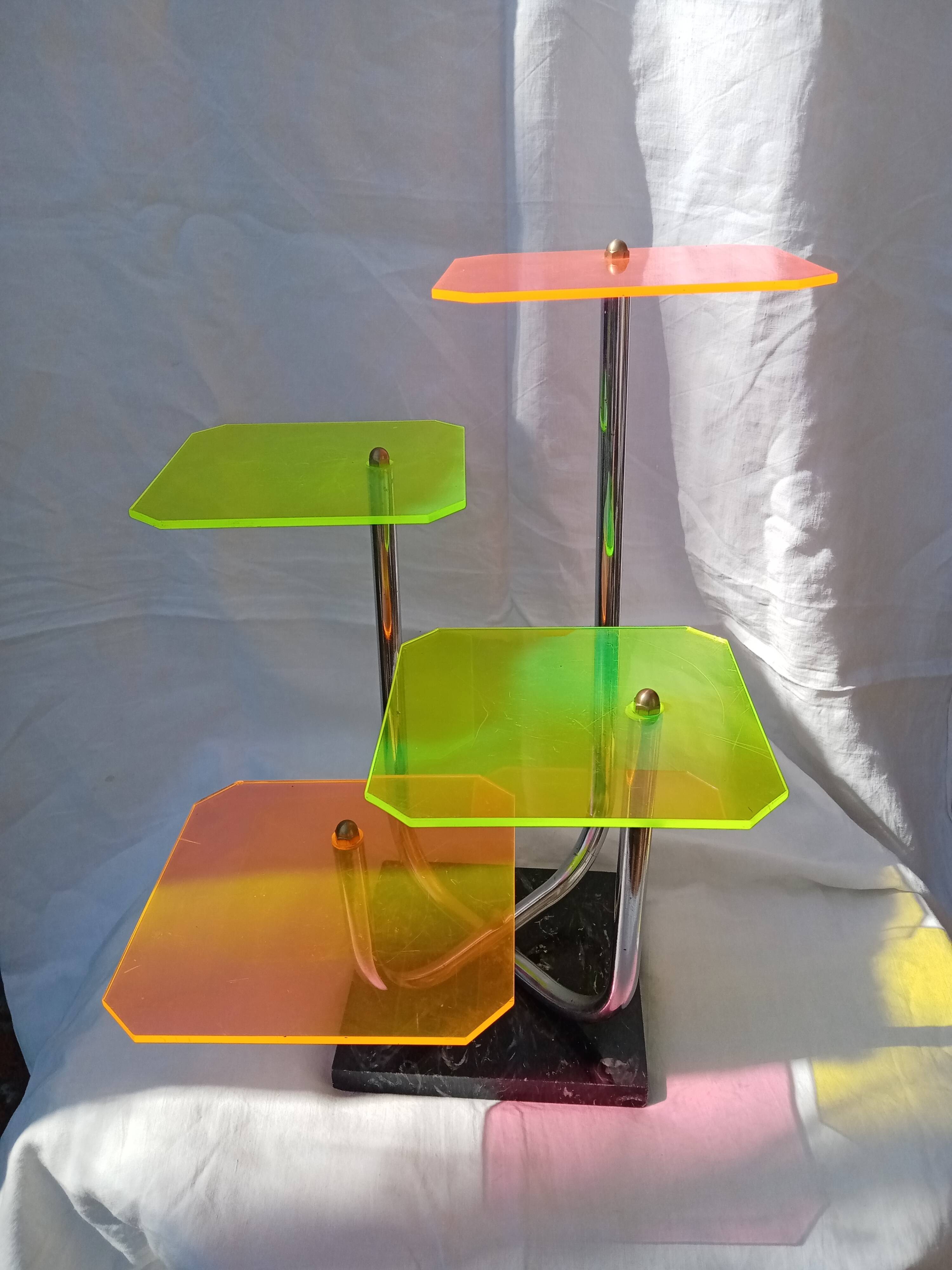 Display shelf with plexiglass trays in 1970s colours.