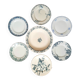Old mismatched dinner plates accompanied by a dish
