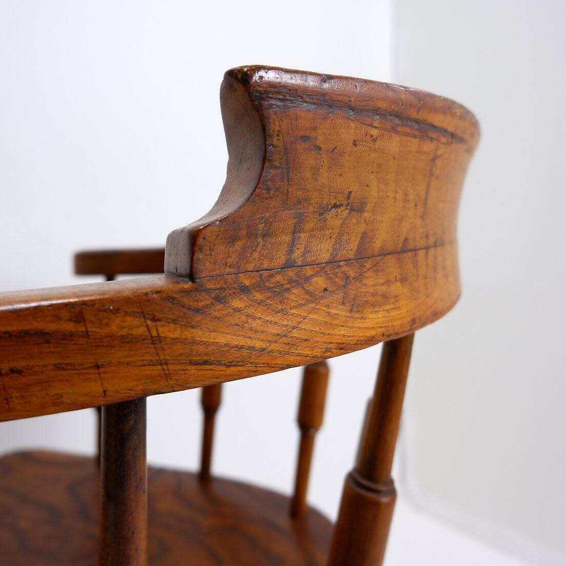 Elm armchair with curved back
