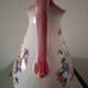 Old ceramic pitcher with floral decoration.
