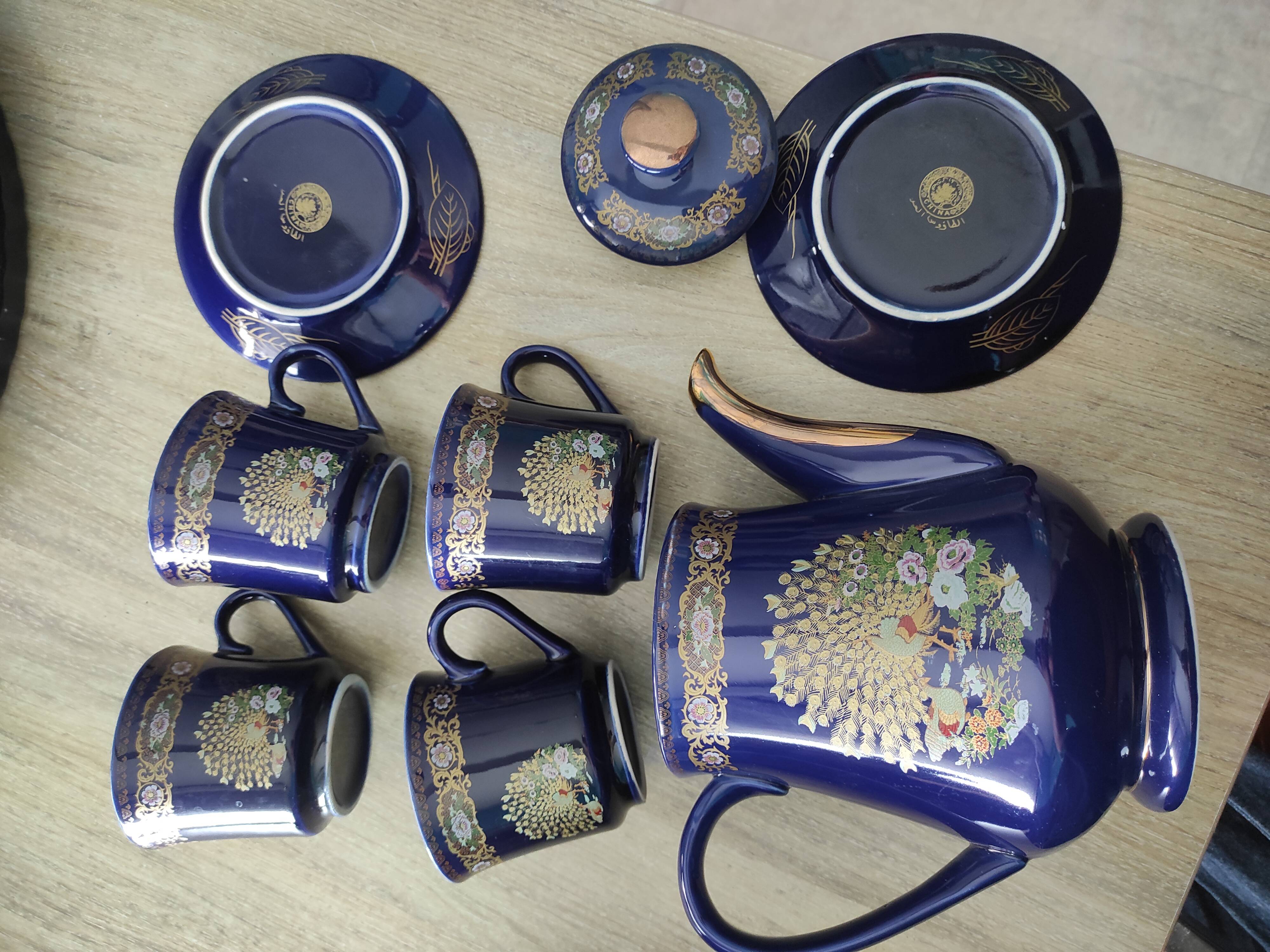 Vintage blue Taous dinnerware set of 21 pieces in very good overall condition.
