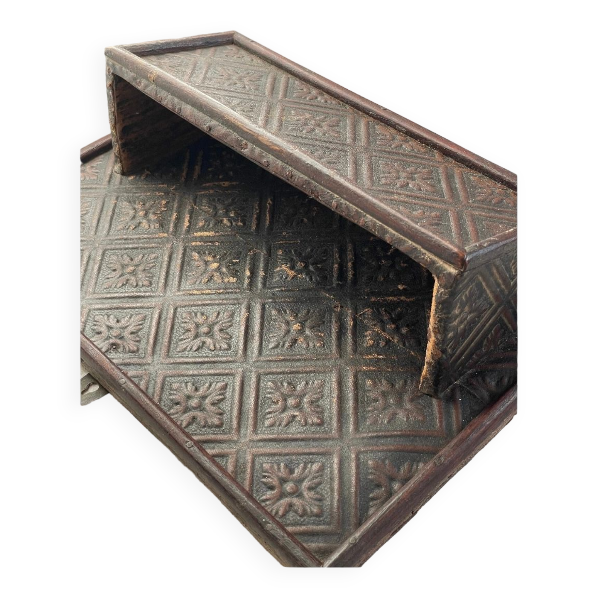 Hammered leather wall mail holder on wood.