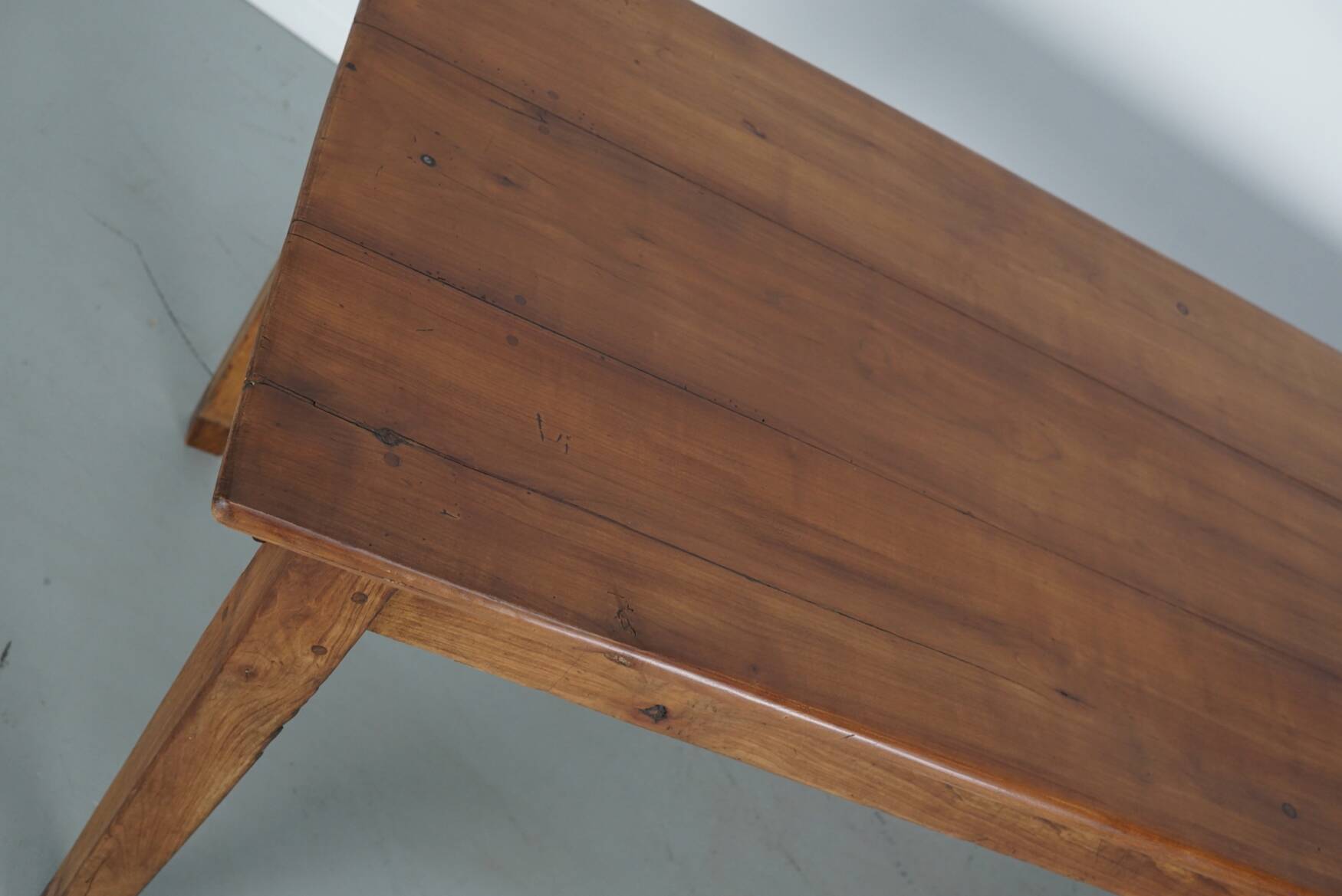 Rustic dining table in fruitwood from the early 20th century
