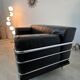 Old vintage leather and tubular metal sofa, design 70s