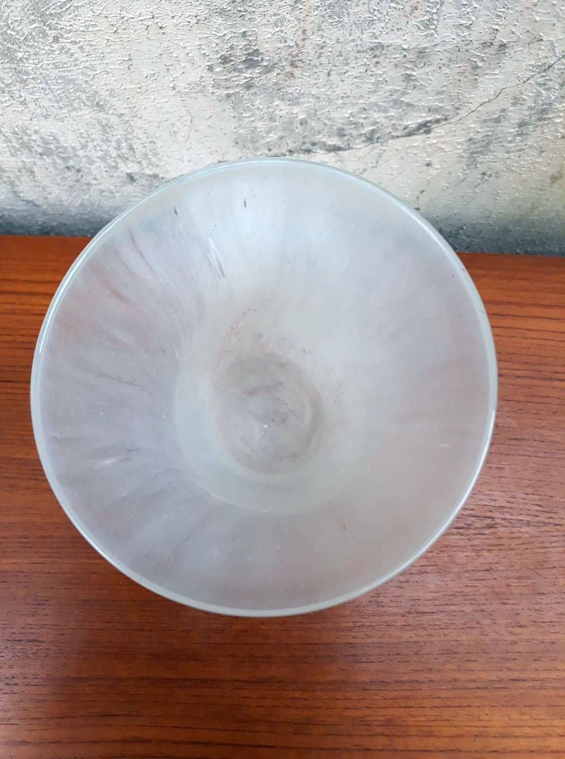 Trumpet vase on a stand in blown glass.