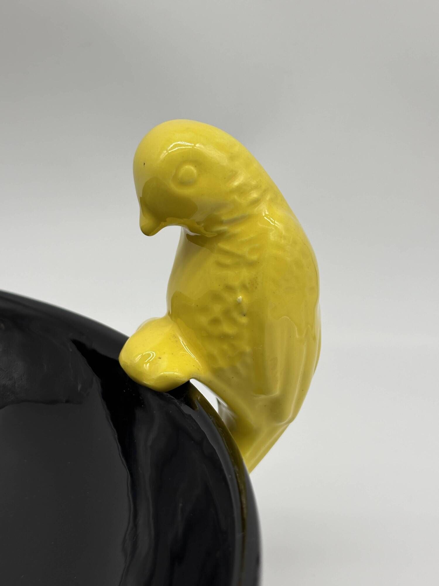 Large vintage black ceramic bowl with yellow parakeets, Vallauris.