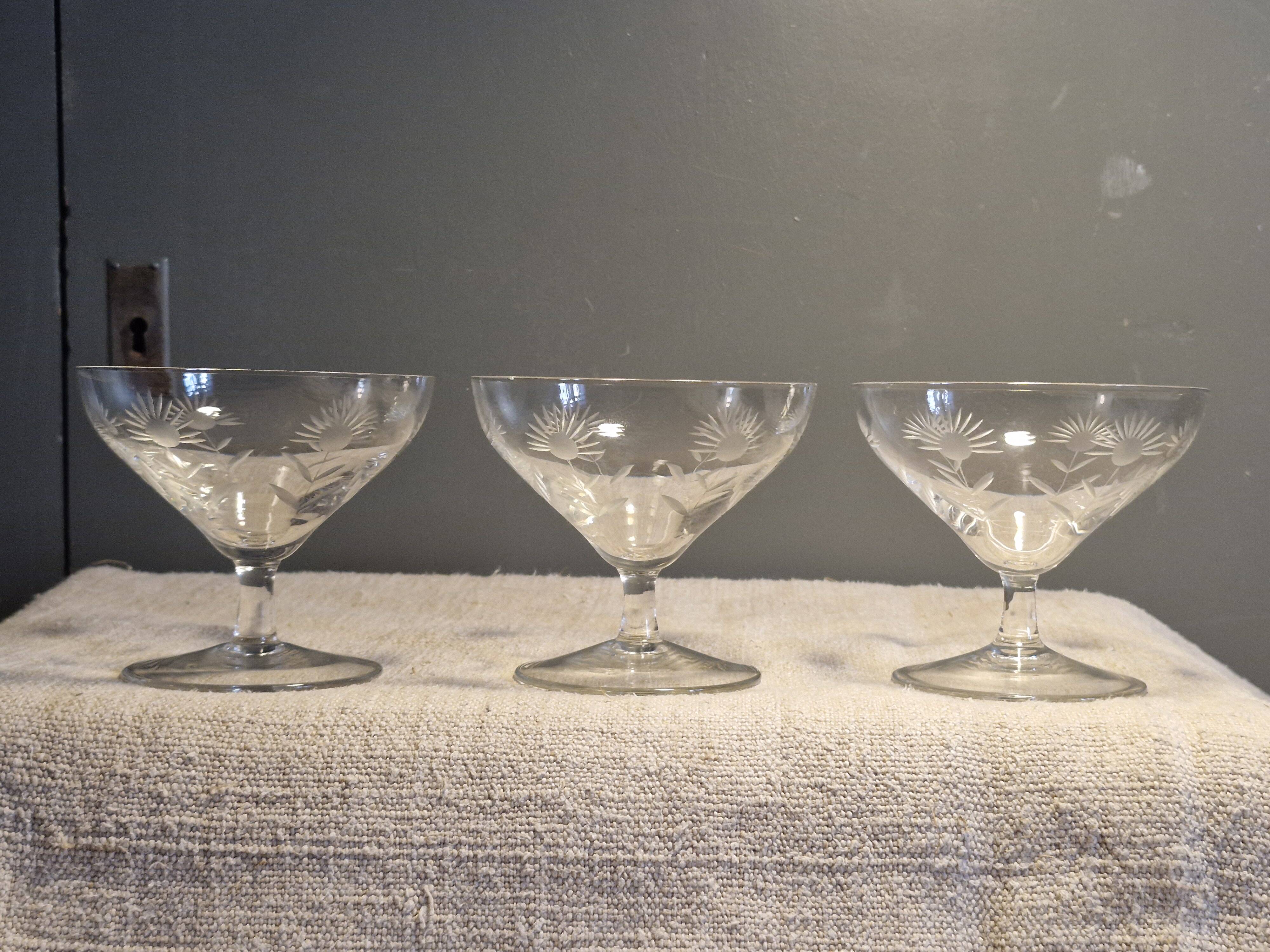 3 antique champagne coupes in engraved crystal with large daisies.