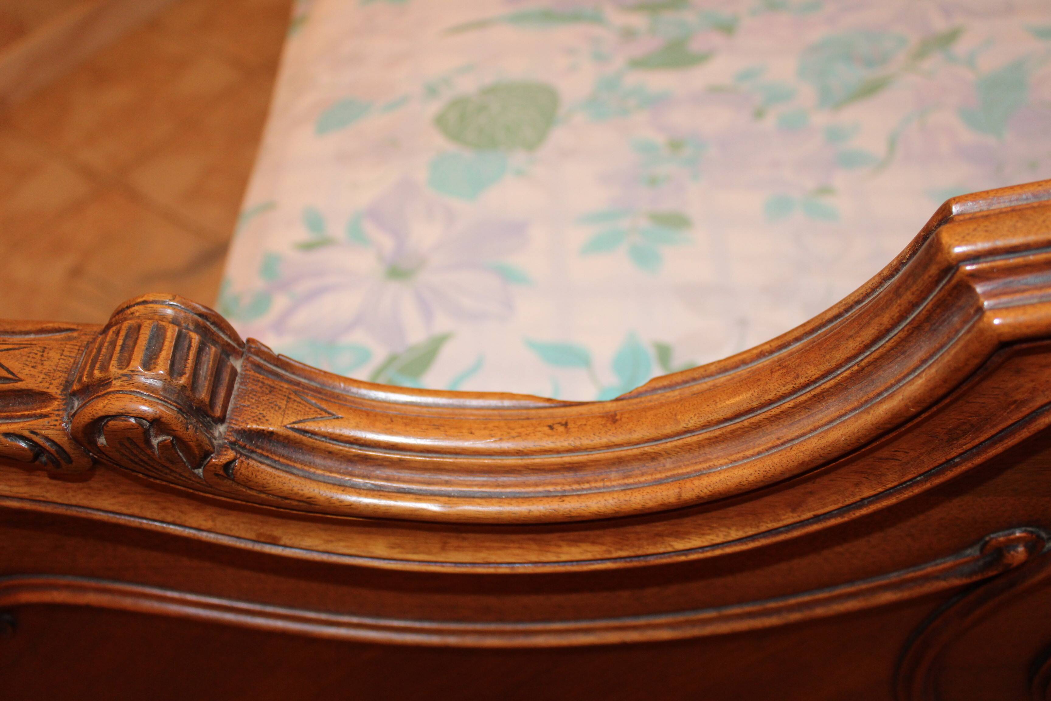 Walnut rocaille bed from the early 20th century.