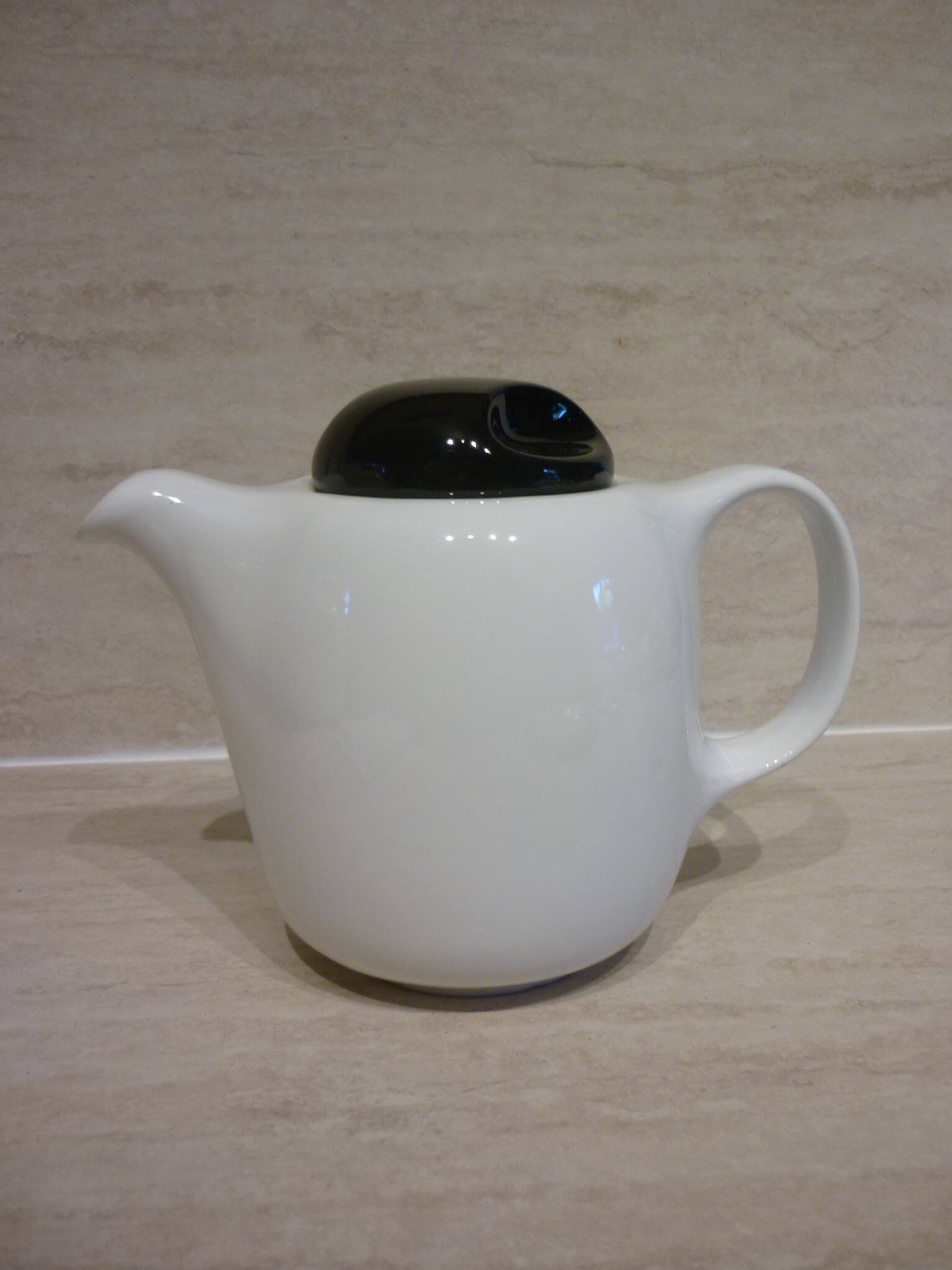 Black and white ceramic coffee maker