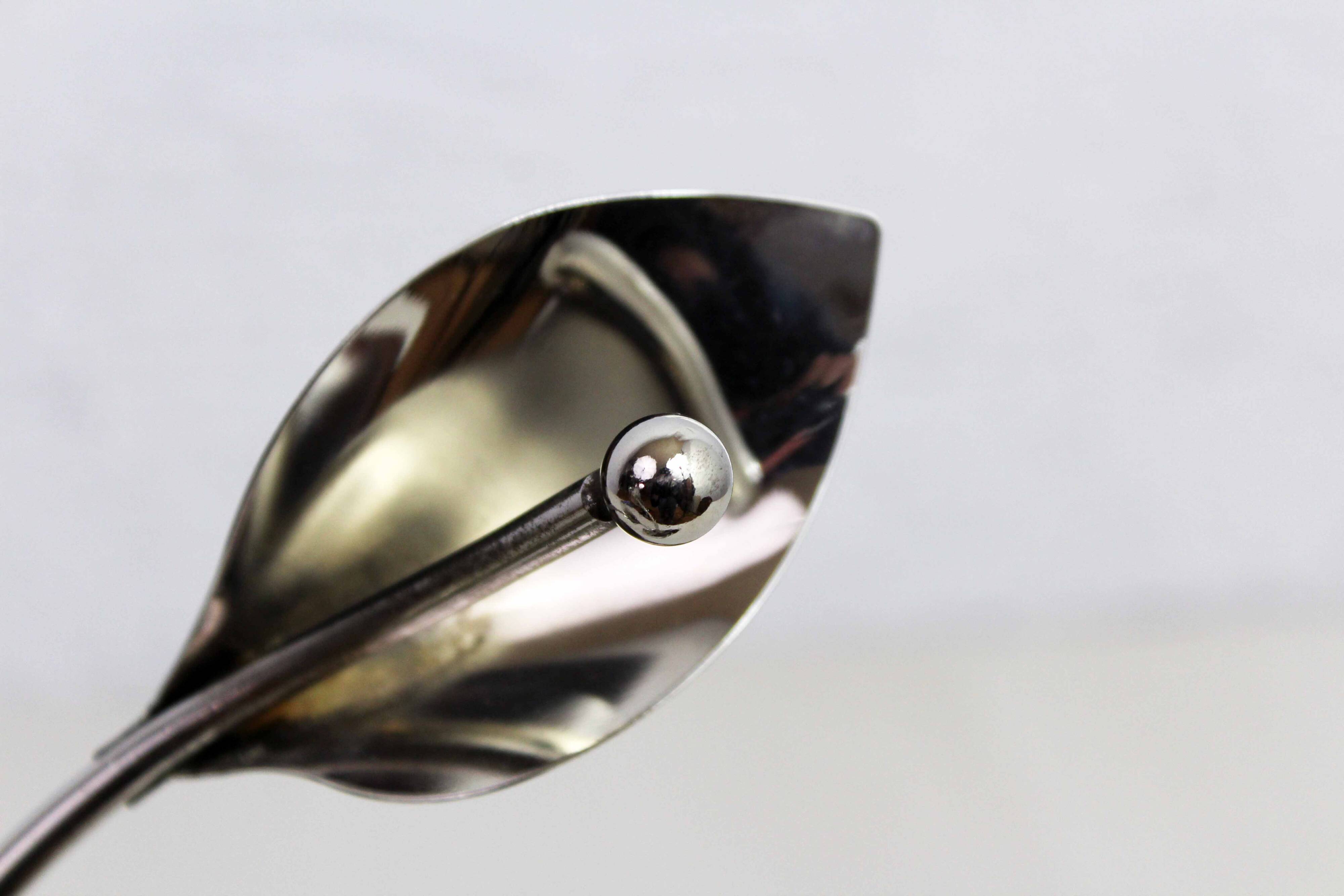 Chrome metal floral candle holder