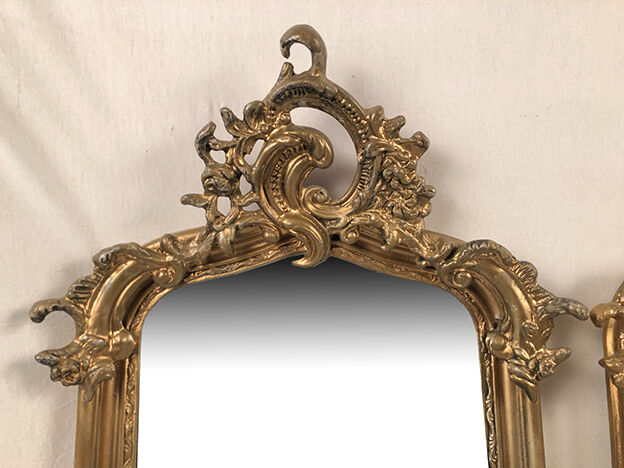 Pair of Louis XV style mirrors, stuccoed and gilded wood, beveled mirrors