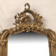 Pair of Louis XV style mirrors, stuccoed and gilded wood, beveled mirrors