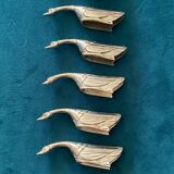 8 silver-colored metal goose-shaped knife holders
