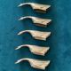 8 silver-colored metal goose-shaped knife holders