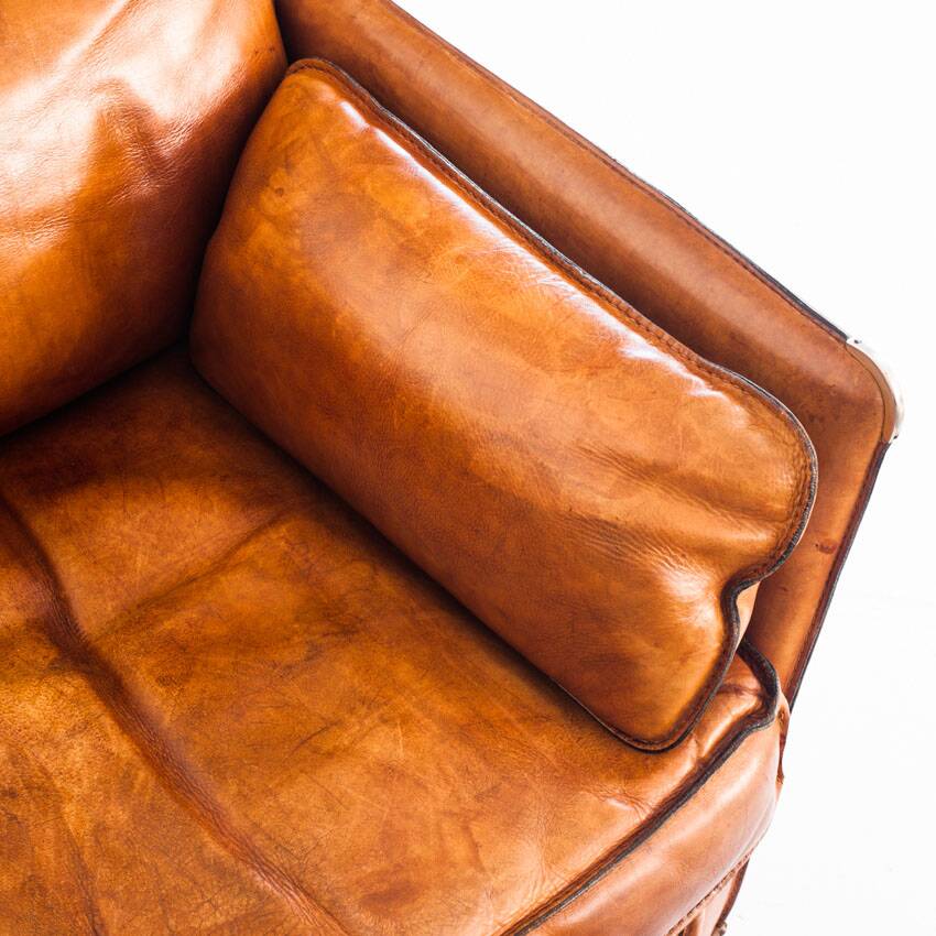 Vintage club armchair by Roche Bobois. Camel buffalo leather. France, 1980s.