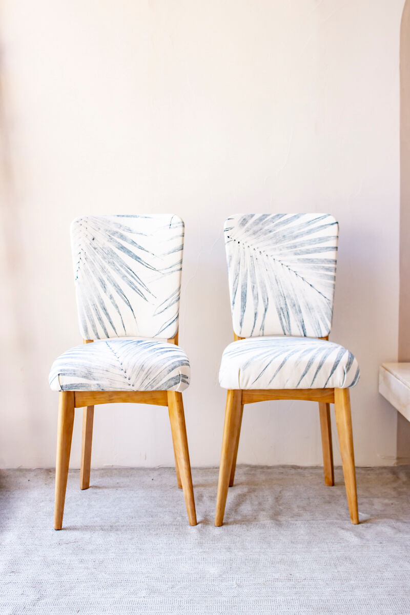 Pair of vintage chairs reupholstered with palm pattern fabric