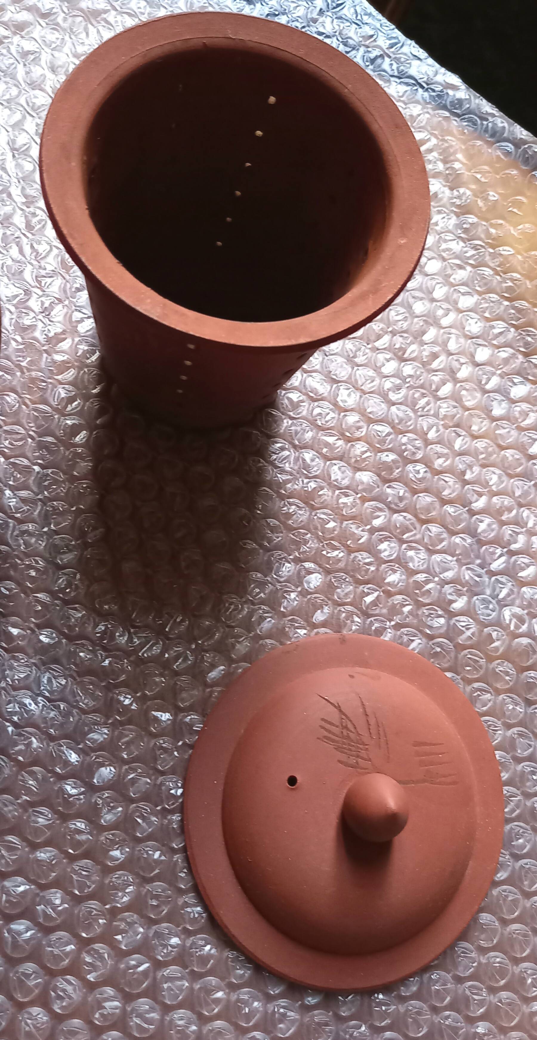 Terracotta and rattan teapot