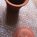 Terracotta and rattan teapot