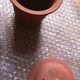 Terracotta and rattan teapot