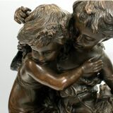 Bronze statue of two children carrying a bouquet of flowers, signed Auguste Moreau (1834-1917)