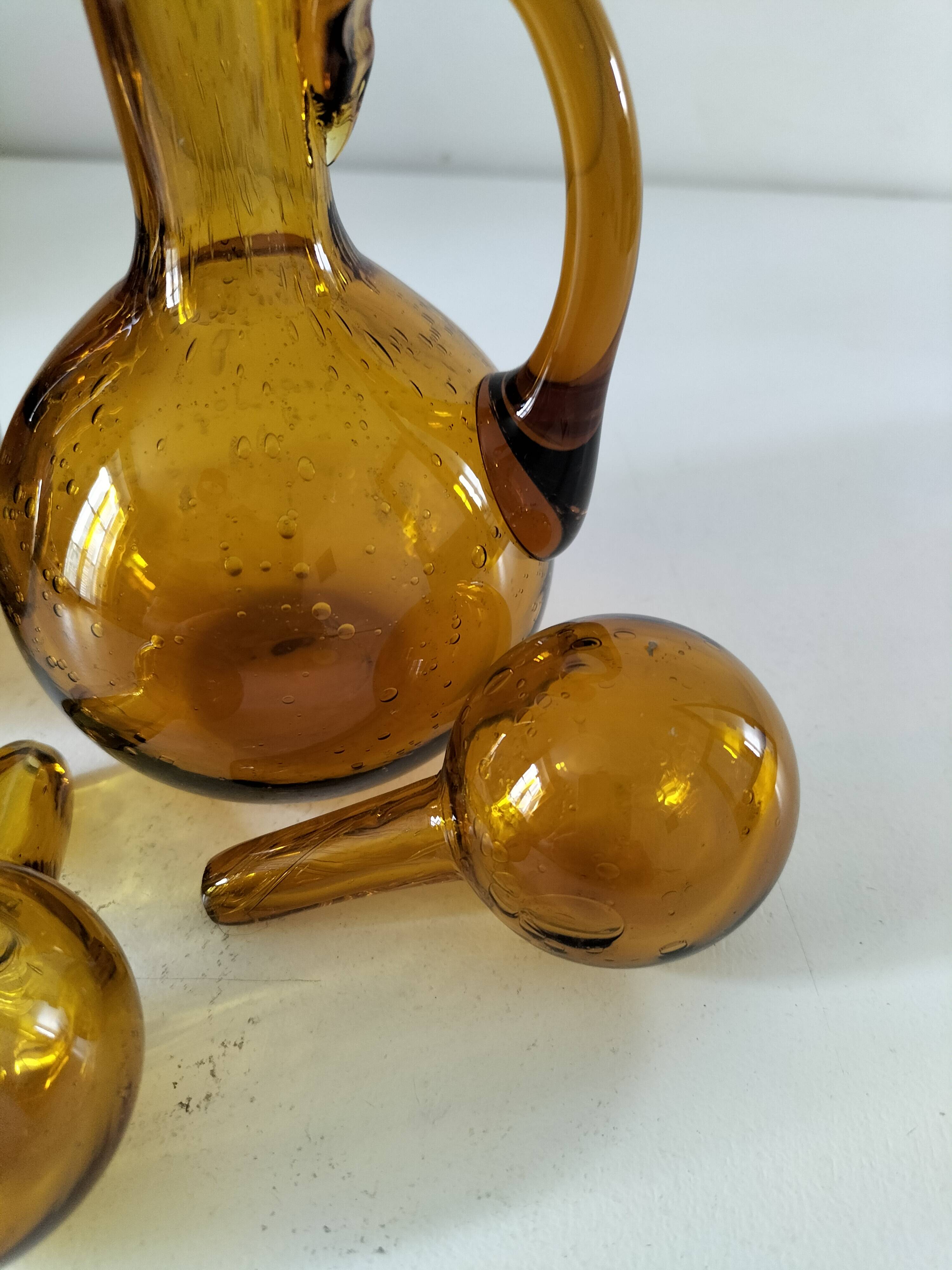 Duo of blown glass carafes – Biot signed – Bubbled amber glass