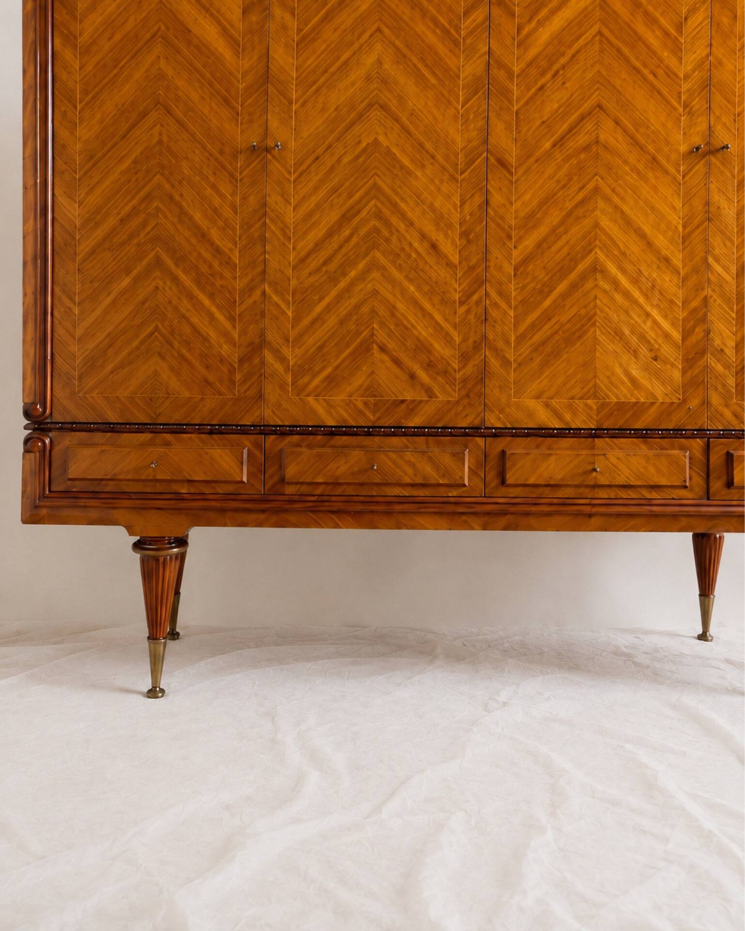 Vintage 4-door chevron wood wardrobe with mirror and gold legs.