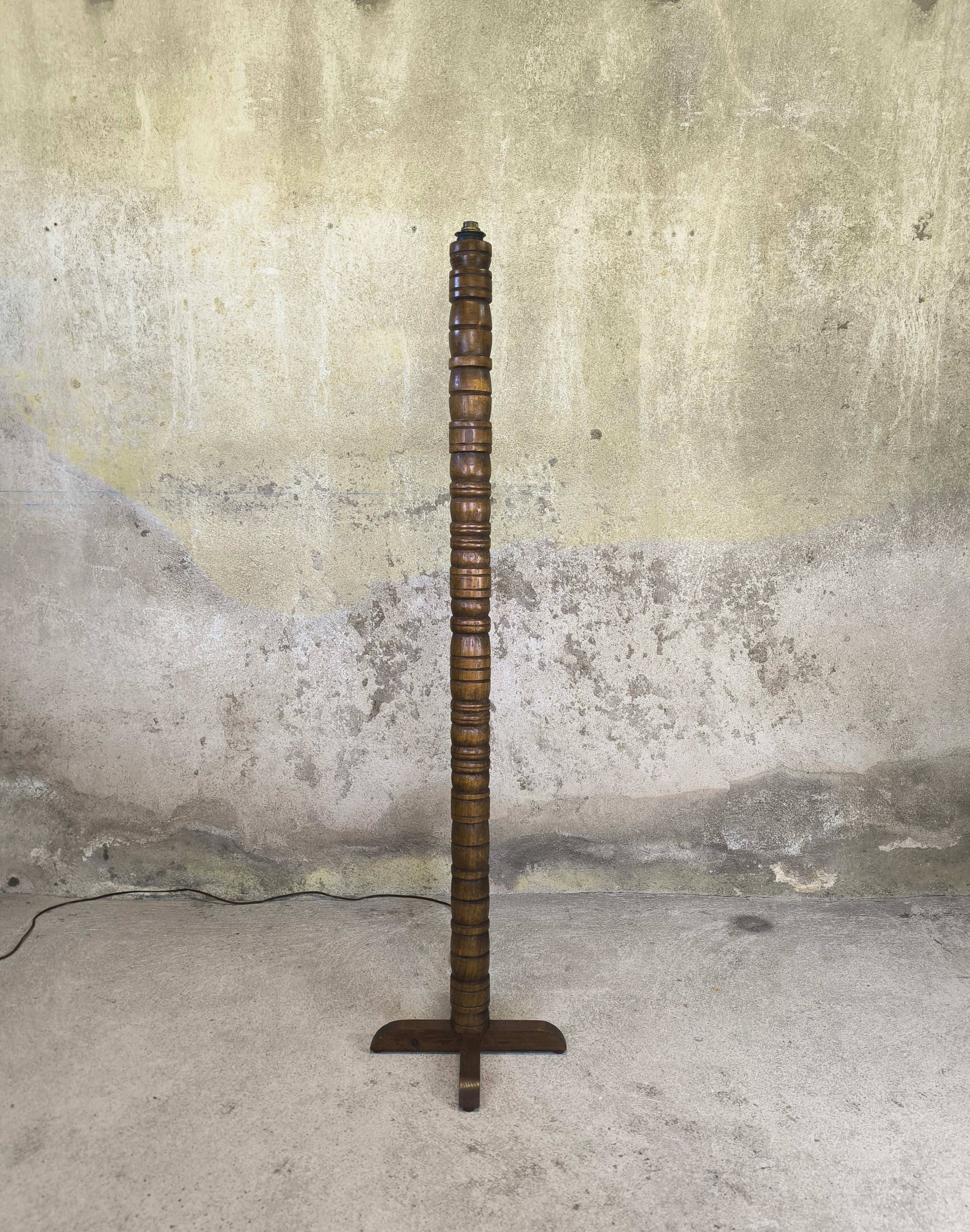 Vintage brutalist floor lamp made of turned wood.
