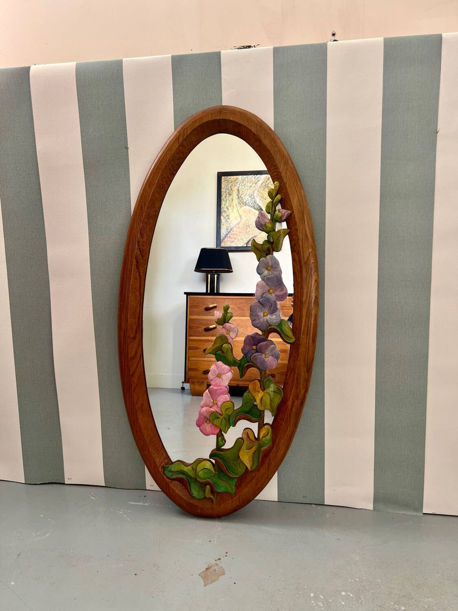 Carved wooden mirror with flower decorations.