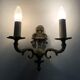 Pair of two-armed fire pot wall lights in gilded bronze.